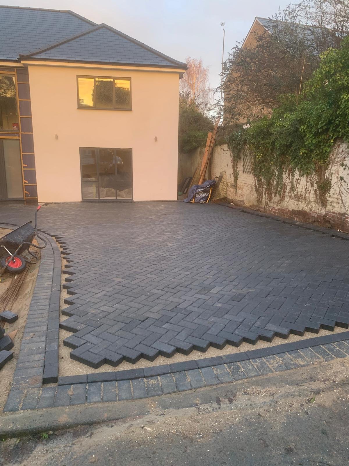 Herringbone block paving driveway with a decorative border